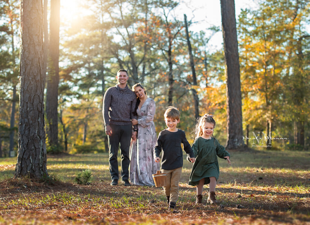 Family walking a laughing during their outdoor fall session in Columbus GA