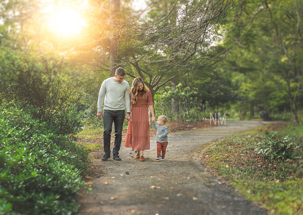A family walking and laughing during their fall family session in Columbus GA, Callaway Gardens.